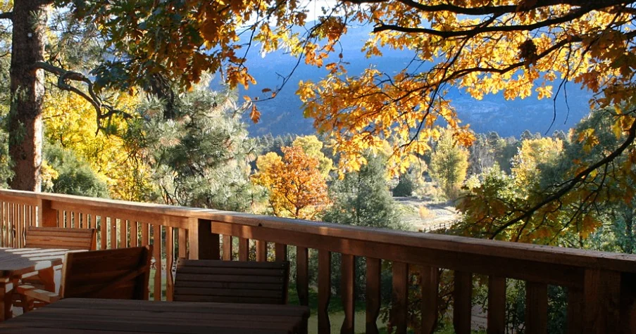 The redwood deck in fall color at Country Sunshine Bed & Breakfast